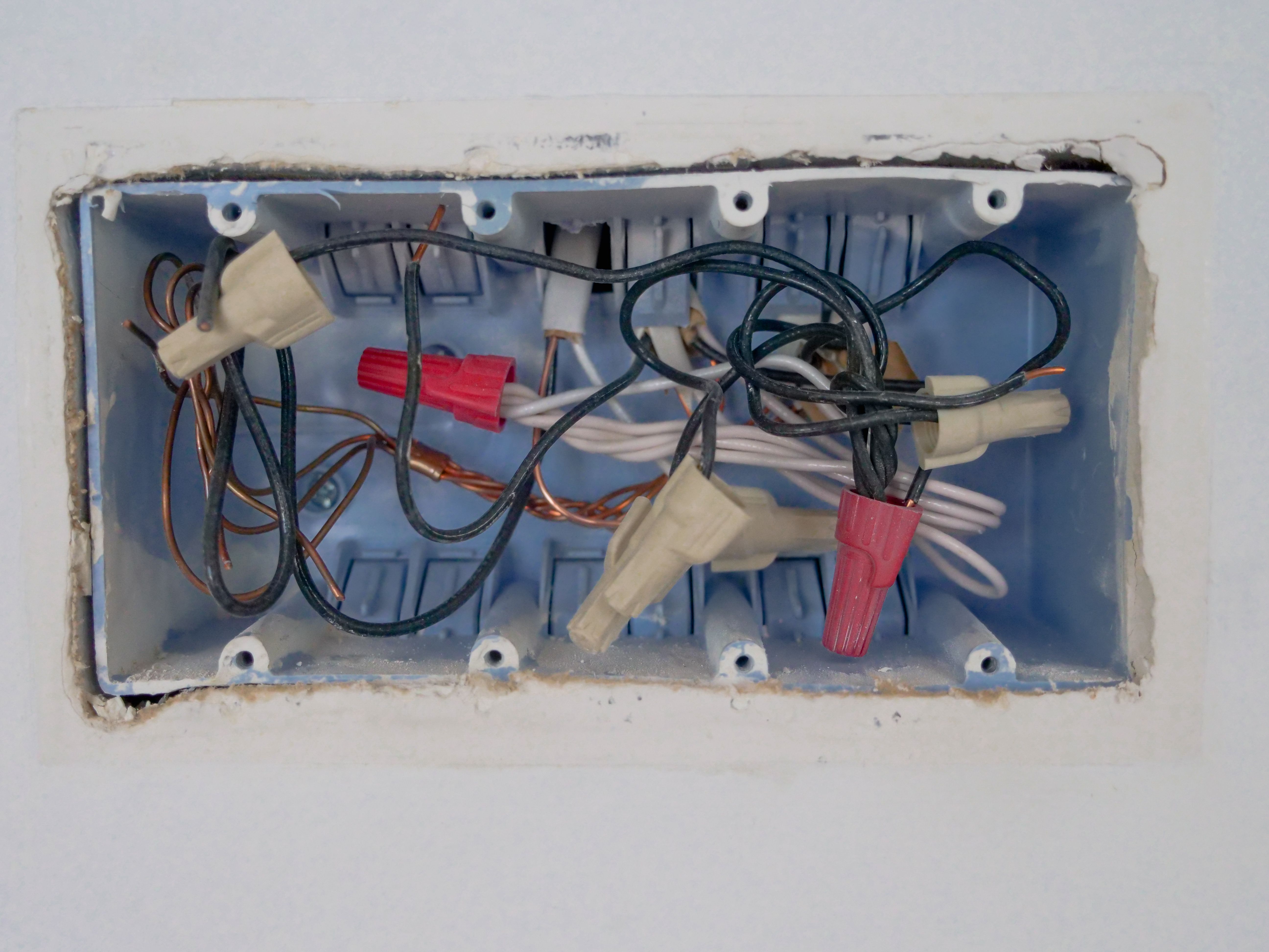 Professional electrician working on electrical panel